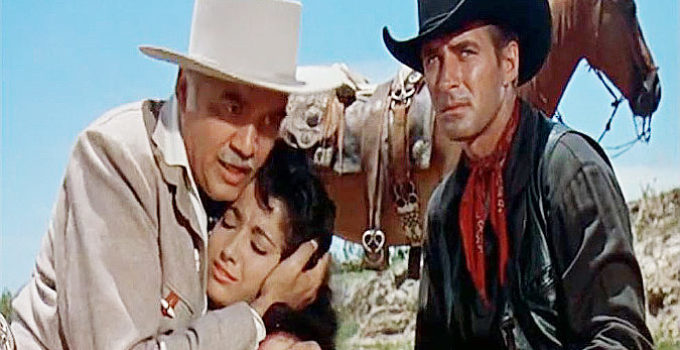 Lorne Greene as King O'Reilly comforts his daughter Maria (Linda Cristal) while Brad Ellison (Jock Mahoney) watches out for a gunman in The Last of the Fast Guns (1958)