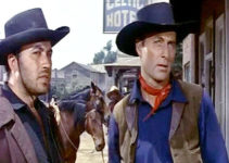 Michael Ansara as Kramer and George Montgomery as Dan Barton, wondering if they'll survive a bank robbery in Last of the Badmen (1957)