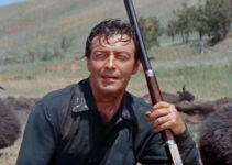 Robert Taylor as Charlie Gilson, resting among the carcasses of some of the buffalo he's killed in The Last Hunt (1956)