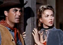 Rory Calhoun as Hemp Brown and Beverly Garland as Mona Langley watching a lynch mob gather in The Saga of Hemp Brown (1958)