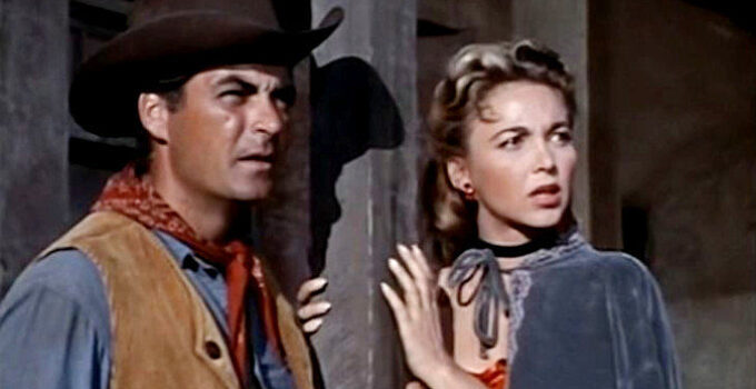 Rory Calhoun as Hemp Brown and Beverly Garland as Mona Langley watching a lynch mob gather in The Saga of Hemp Brown (1958)