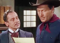 Baron Kurtvan Triesault as Baron Von Hollden and Joel McCrea as Clete Mattson in Border River (1954)