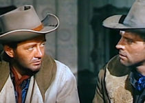 Robert Walker as Lee Strobie and Burt Lancaster as Owen Daybright, discussing Lee's newly born problem in Vengeance Valley (1951)