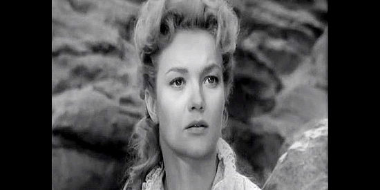 Patrice Wymore as Johanna Carter, heading West to meet her fiance when the Indians attack the stagecoach in Rocky Mountain (1950)