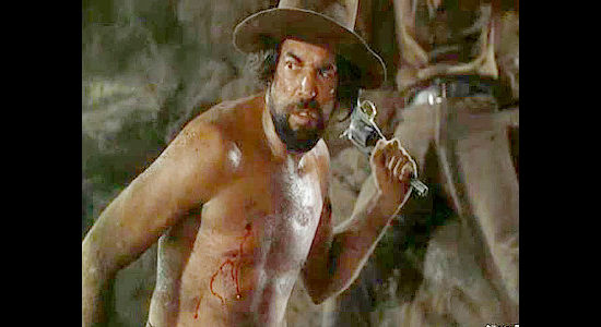 Paul Fiero as Ramon, one of the prison escapees, during a fight in a mine in Passage West (1951)