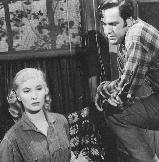 Penny Edwards as Susan Crowley with Bing Russell as Cpl. Norman in Rider a Violent Mile (1957)