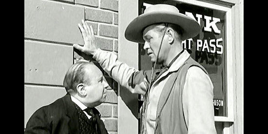 Percy Helton as undertaker Boggs and David Brian as Whitey Turner, planning a bank robbery in Fury at Gunsight Pass (1956)