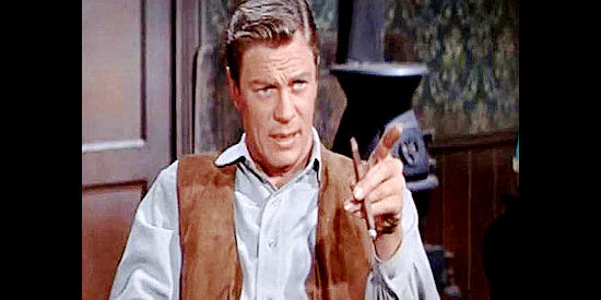 Peter Graves as Bob Andrews, making a point with his business partners in Canyon River (1956)