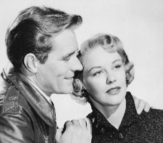 Philip Carey as Doc Woodrow and Dorothy Patrick at Mary Saunders in Outlaw Stallion (1954)