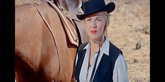 Phyllis Coates as Janice Hamitlon, waiting for her orders as the cattle drive begins in Cattle Empire (1958)