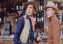 George Montgomery as Dan Beattie and House Peters Jr. as Curt Warren in The Man from God's Country (1958)