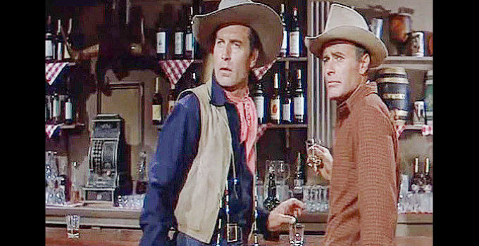 George Montgomery as Dan Beattie and House Peters Jr. as Curt Warren in The Man from God's Country (1958)