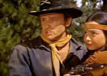 John Ericson as Lt. Niles Ord, rescuing Little Deer (Toni Gerry) a second time in Oregon Passage (1958)