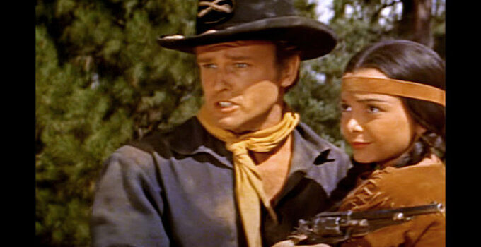 John Ericson as Lt. Niles Ord, rescuing Little Deer (Toni Gerry) a second time in Oregon Passage (1958)