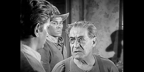 Ralph Moody as Doc Henry, asking questions about his new patient in The Legend of Tom Dooley (1959)
