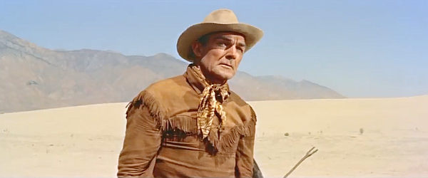 Randolph Scott as Ben Brigade, a man with a bounty to collect and an old score to settle in Ride Lonesome (1959)