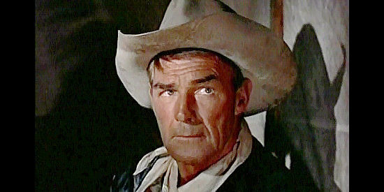 Randolph Scott as Ben Stride, warning Bill Masters to watch what he says about Annie Greer in Seven Men from Now (1956)