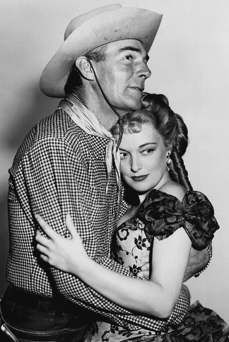 Randolph Scott as Jim Redfern with Karin Booth as Frances Harrison in Cariboo Trail (1950)