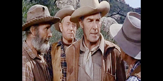 Randolph Scott as Larry Delong, caught by members of the Marady gang in Riding Shotgun (1954)