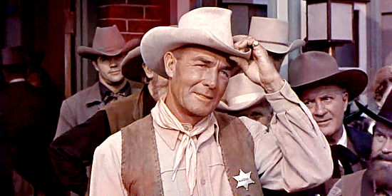Randolph Scott as Marshal Calem Ware, welcoming a new guest to Medicine Bend in A Lawless Street (1955)