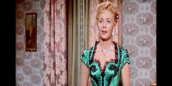 Randy Stuart as Nancy Dawson, a woman who wants to make sure her relationship with Beau Santee pays off in The Man from God's Country (1958)