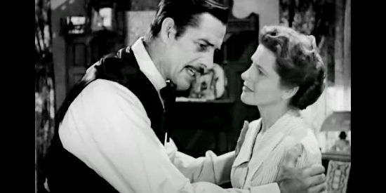 Reed Hadley as Frank James, fretting about the Jesse rumors with wife Ann (Barbara Woodell) in The Return of Jesse James (1950)