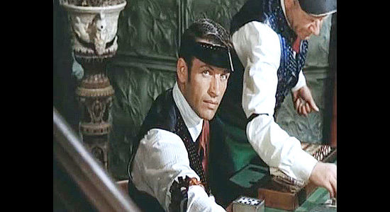 Richard Egan as Strap Galland, Larry's brother, working undercover as a faro dealer in Cripple Creek (1952)