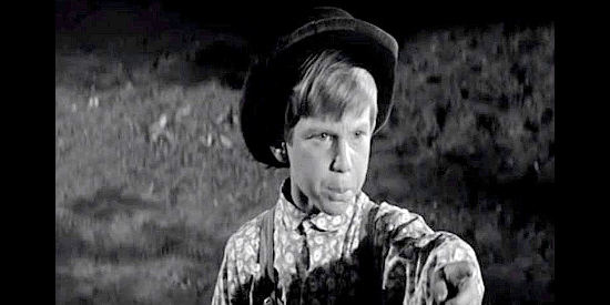 Ricky Allen as Timmy Martin, vowing vengeance against the man who killed his father in Plunderers of Painted Flats (1959)
