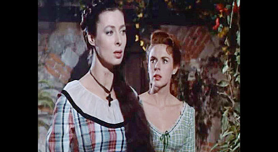 Rita Gam as Felicia Delmonte and Mala Powers as Sue Russell, reacting to an unexpected turn in Sierra Baron (1958)