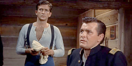 Robert Knapp as Lt. Waller and Gregg Palmer as Capt. Tinslip, hearing of a possible mutiny in Revolt at Fort Laramie (1957)