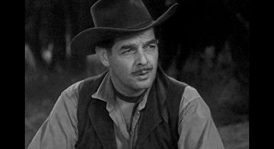 Robert Lowery as Clyde Moss, the homesteader planning to double cross a good friend in The Homesteaders (1953)