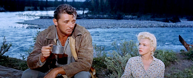 Robert Mitchum as Matt Calder and Marilyn Monroe as Kay discuss the odds of completing their journey in River of No Return (1954)