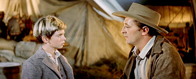 Robert Mitchum as Matt Calder finds son Mark (Tommy Retig) in a mining camp in River of No Return (1954)