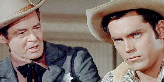 Robert Ryan as Cass Silver, trying to get Thad Anderson (Jeffrey Hunter) to accept the truth about his father's death in The Proud Ones (1956)