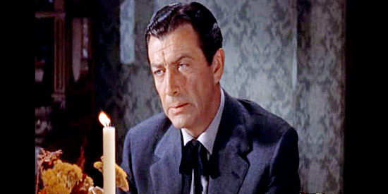 Robert Taylor as Jake Wade, who helps a former friend escape prison and comes to regret it in The Law and Jake Wade (1958)