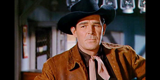 Rod Cameron as Will Ballard, deterrmined to help Celia Evarts hold onto her ranch in Ride the Man Down (1952)