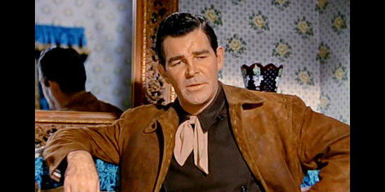 Rod Cameron as Will Ballard, explaing his loyalty to the Hatchet ranch to fiance Lottie in Ride the Man Down (1952)