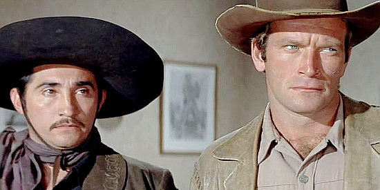 Rodolfo Acosta as Chico and Ken Clark as Pike, two of John Barrett's hired guns in The Proud Ones (1956)