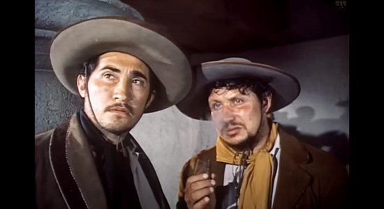 Rodolfo Acostas as Salvador Sandro (left), head henchman for Don Domingo in Passion (1954)