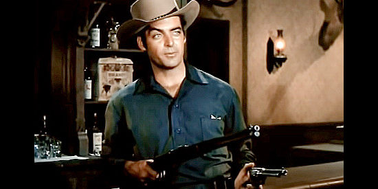 Rory Calhoun as Chino Bull, well-armed for trouble in Powder River (1953)