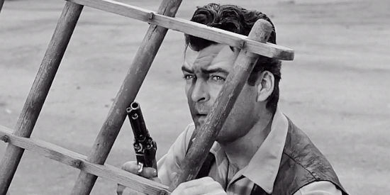 Rory Calhoun as Domino Kid, taking cover during a shoot-out in The Domino Kid (1957)
