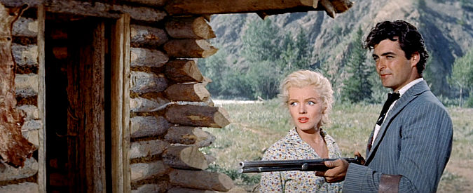 Rory Calhoun as Harry Weston decides to take what he wants by force as Kay (Marilyn Monroe) looks on in River of No Return (1954)