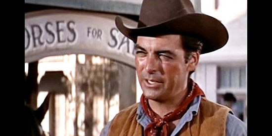 Rory Calhoun as Hemp Brown, searching for clues on where he can find Jed Givens in The Saga of Hemp Brown (1958)