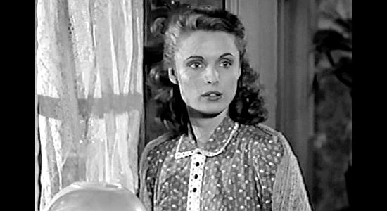 Rosemarie Bowe, aka Rosemarie, as Ann Davis, warning of a cattleman's approach in The Peacemaker (1956)