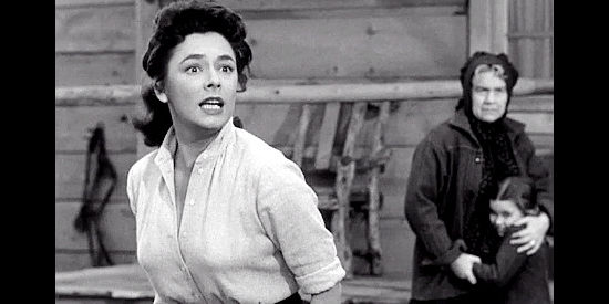 Ruth Roman as Nora Willoughby, reacting to her husband's attack on Gray Mason in Rebel in Town (1956)