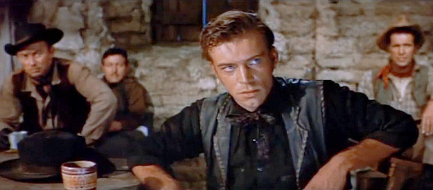 Skip Homeier as Jack Sutton, son of a cattle king, trying to get answers from a stubborn young woman in The Burning Hills (1956)