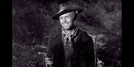 Sterling Franck as Cain Mason, with a gun pulled on brother Wesley in Rebel in Town (1956)