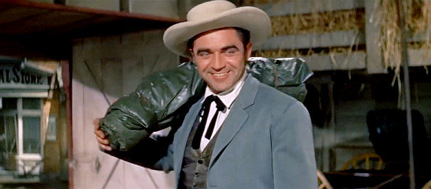 Steve Cochran as a Confederate officer posing as horse tradeer Mike Davis in Quantrill's Raiders (1958)