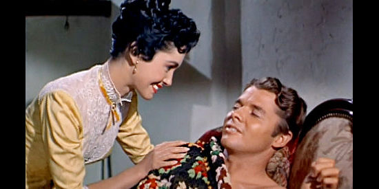 Susan Cabot as Laurie Kenyon cares for a wounded Clay O'Mara (Audie Murphy) in Ride Clear of Diablo (1954)