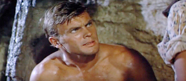 Tab Hunter as Trace Jordan, finding an ally in his quest for justice in The Burning Hills (1956)